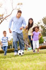 stock-photo-48090908-hispanic-family-playing-soccer-together.jpg