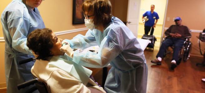 The lack of daily oral care in nursing facilities is “an epidemic that’s almost universally overlooked,” said Dr. Sarah Dirks, right, a dentist who treats nursing home residents in San Antonio.