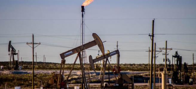 An oil field operation flares natural gas in the area of Loco Hills, between Artesia and Hobbs, in this Journal file photo. Gov. Michelle Lujan Grisham’s administration is opposing federal regulations that would remove certain methane emission limits. (Roberto E. Rosales / Journal)