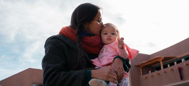   Emily Rose and her daughter. Nandi Hill, a licensed and certified professional midwife and founder of Wadada Midwifery Care in Albuquerque, New Mexico, was excited that, on that day in March, the time had come to help Rose bring a baby girl into the world with an at-home water birth. Courtesy Tomas Karmelo Amaya 